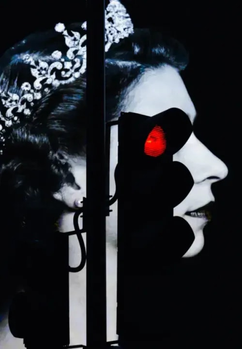 A red-stoplight layered over an image of the queen of England in place of her eye.